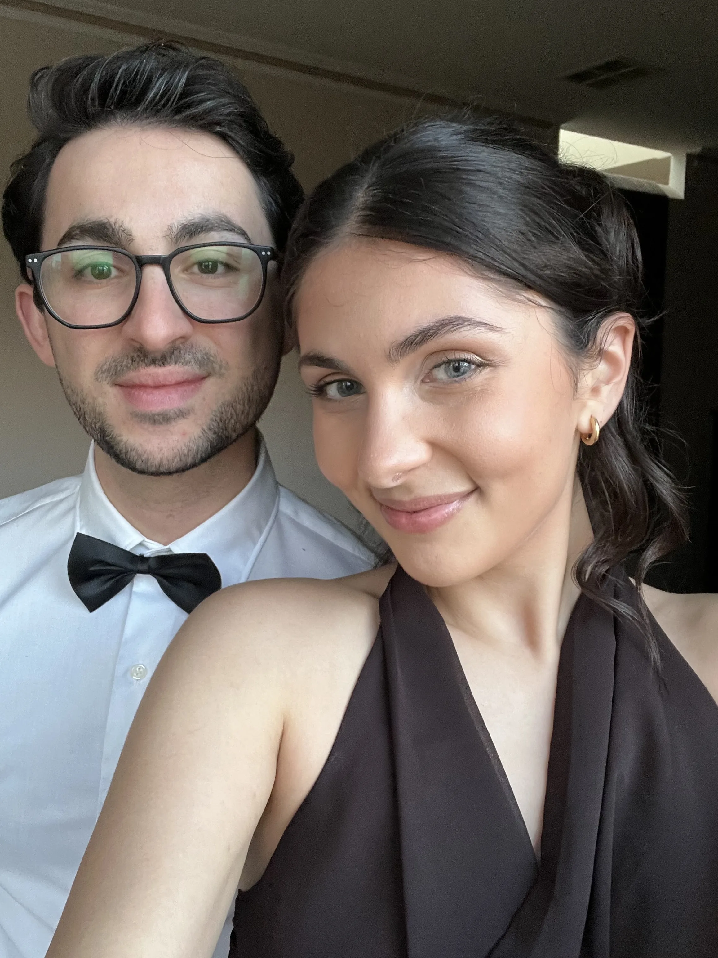 Formal event styling — couple in formalwear, dark low chignon