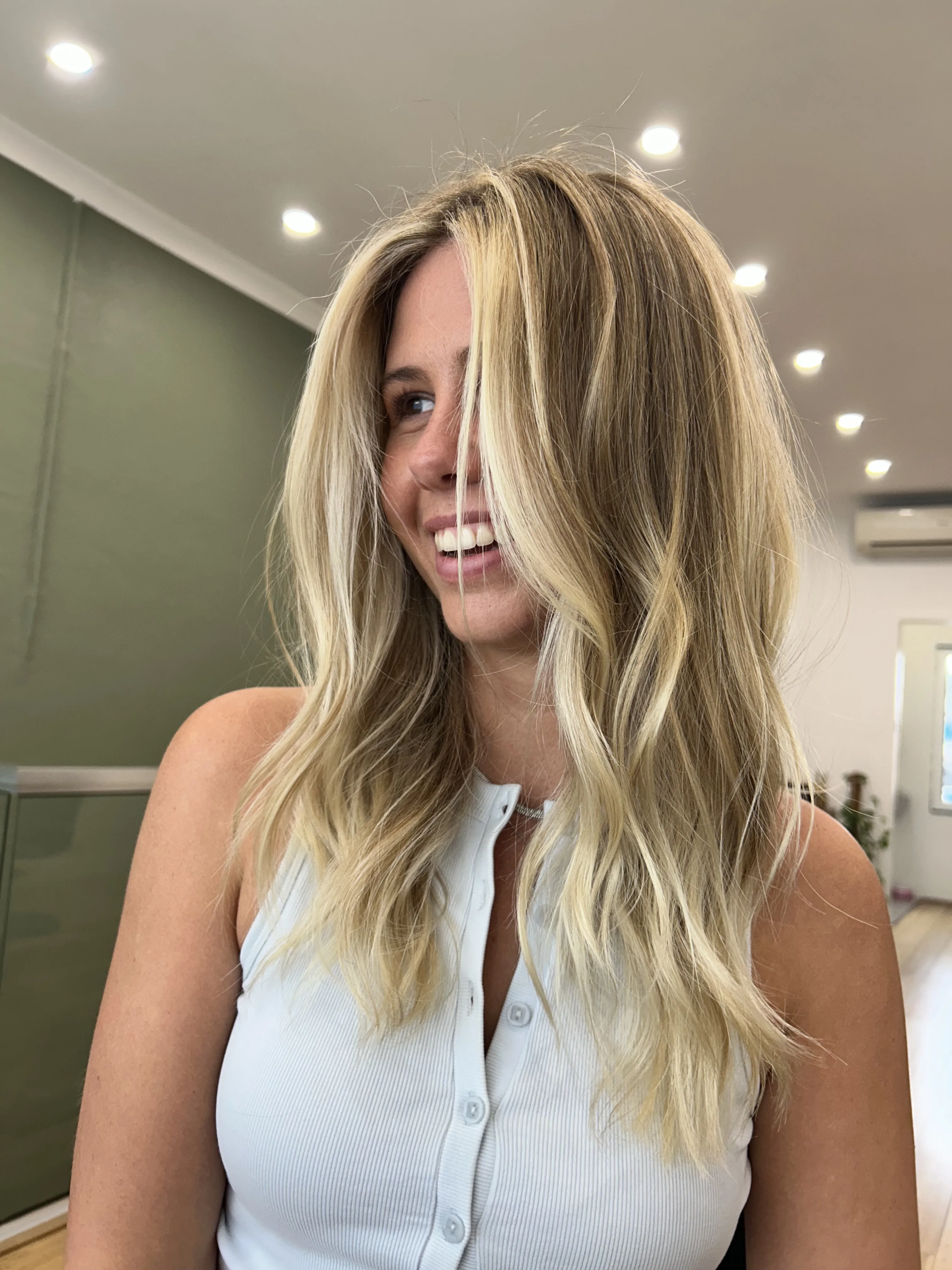 Client laughing, long blonde beachy waves