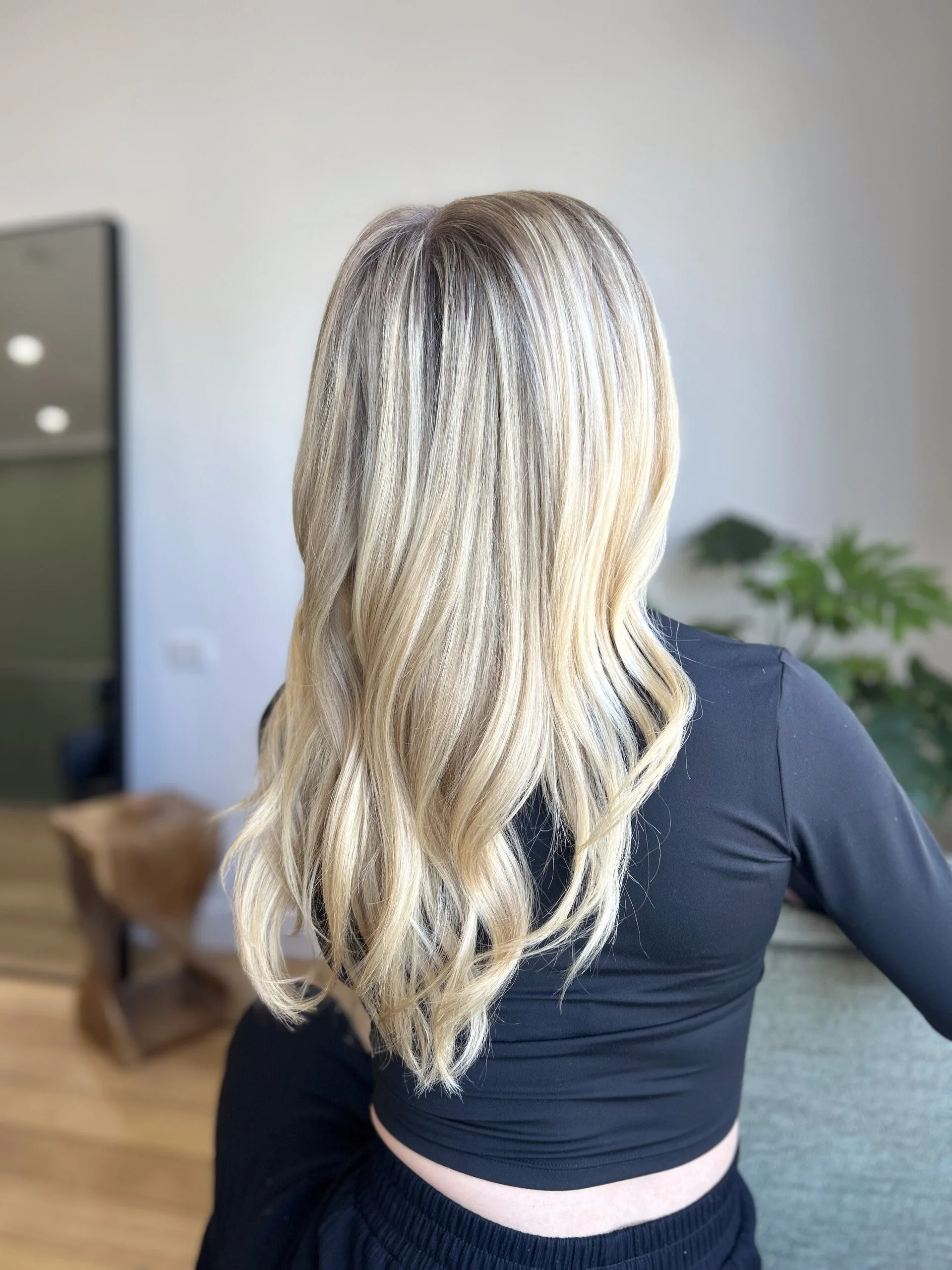 Long icy-blonde waves, back view